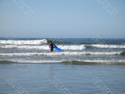 park waterfall with concrete wall behind