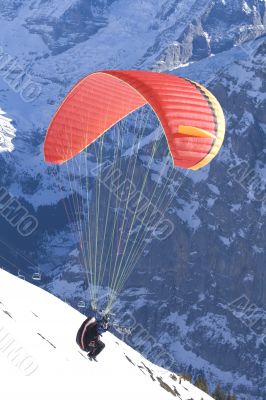 Paraglider taking-off in the mountains