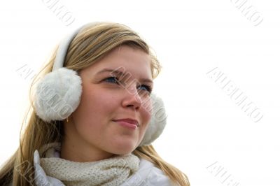 Cheerful cute girl in muffs