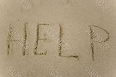 Help sign on the sand