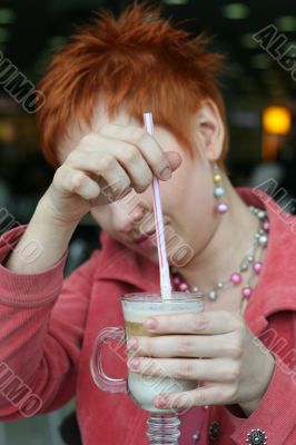 woman dreanking coffe in cafe and smiling happy