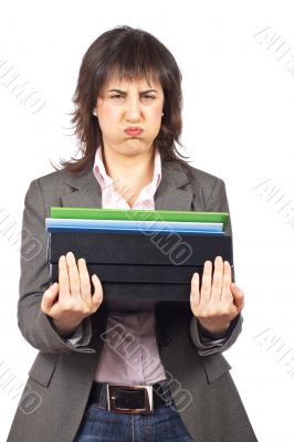 Busy business woman carrying stacked files