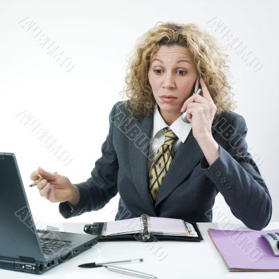 Unhappy businesswoman phoning