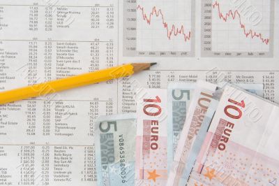 Money, stocks charts and pencil