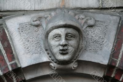 Keystone with face in brick arch