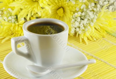 Fresh cup of coffee with flowers Fresh cup of coffee with flowers