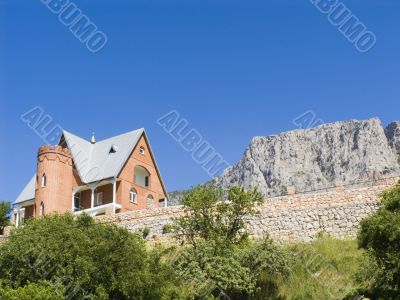 Stone cottage in mountains