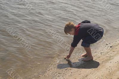 Boy Playing at the Ocean Boy Playing at the Ocean