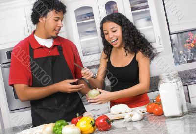 young couple cooking