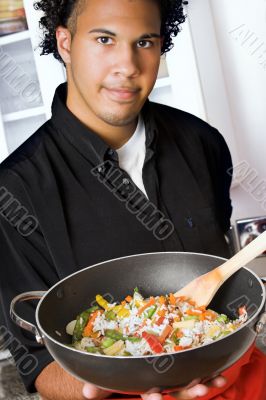 young chef presenting food