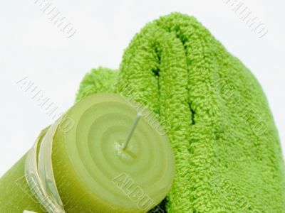 Green towels and candle