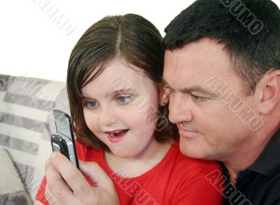 Father And Daughter With Phone Father And Daughter With Phone