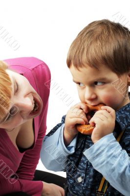 mom and her son eating one bagel