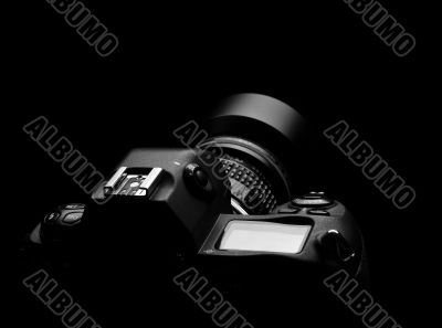 SLR camera on black spot light