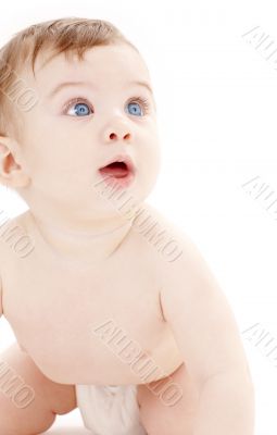 portrait of crawling baby boy looking up 2