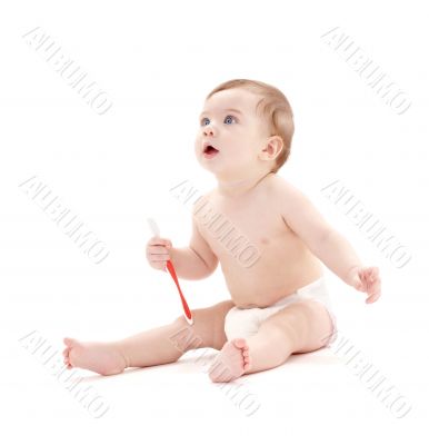 baby boy in diaper with toothbrush 2