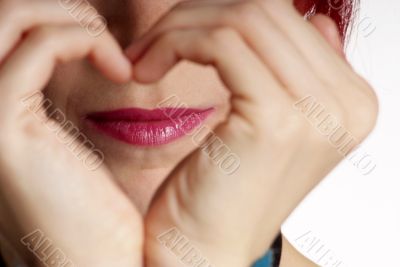 woman shows heart woman shows heart