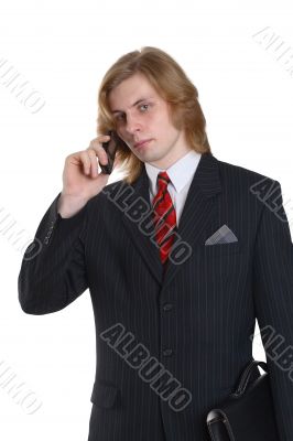 a businessman in a suit talking telephone