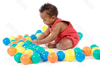 Baby with balls