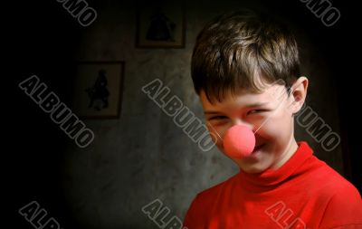 Smiling boy in dark room