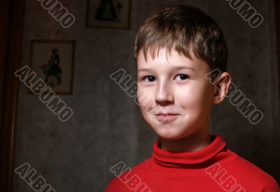 Smiling boy in dark room