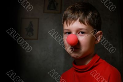 Upset boy in dark room