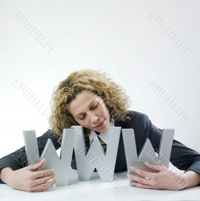 Woman hugging three large letters www