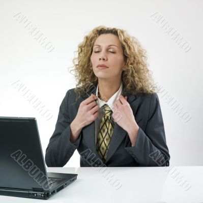 Businesswoman adjusting jacket