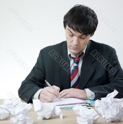 Businessman  with difficulty to write