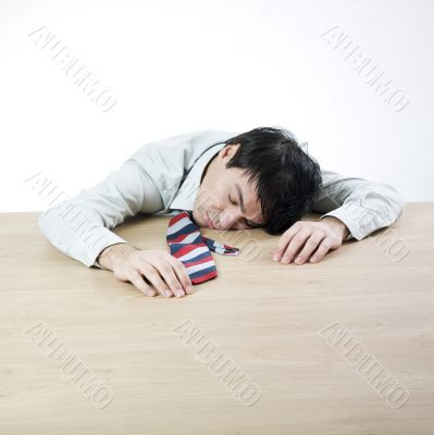 Businessman sleeping on a table