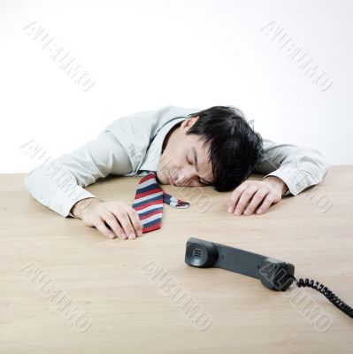 Businessman sleeping on a table