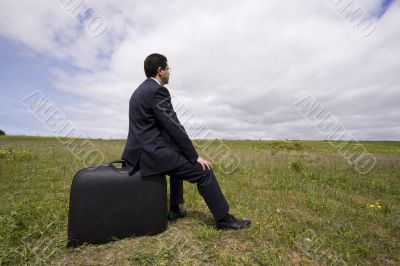 businessman sit in his baggage