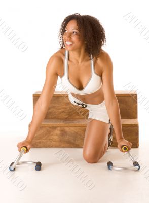 Dark skinned woman with push up bars