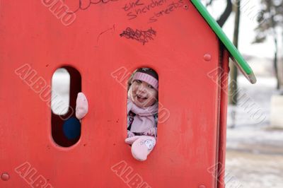 girl play hide-and-seek at the playground