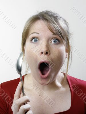 Surprised woman with fork