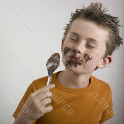 Boy eating chocolate