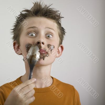 Boy eating chocolate