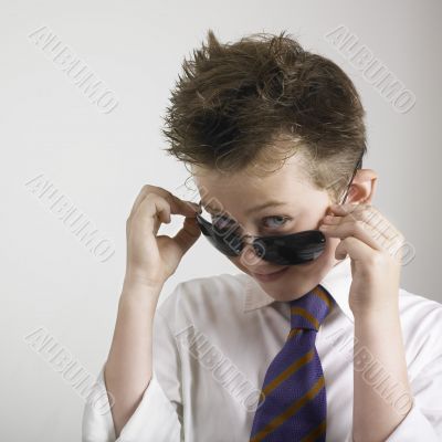 Boy smiling with sunglasses
