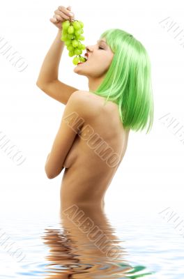 green hair girl with a bunch of grapes in water
