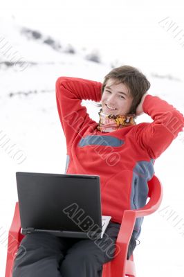 Happy teens student with laptop in hand