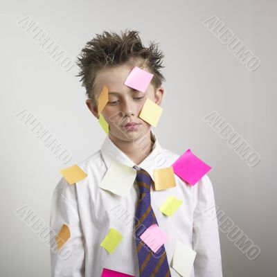 Sad boy with postit