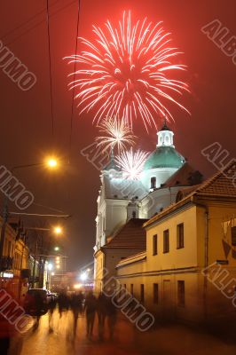Celebratory fireworks behind a Catholic church