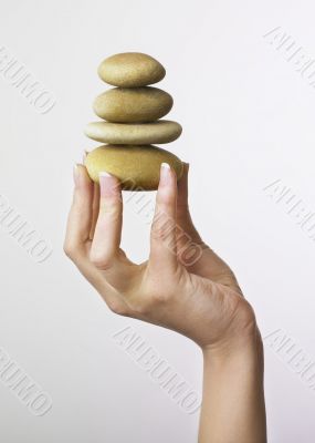 Hand holding stones