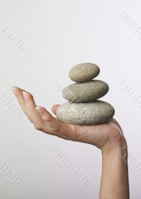 Hand holding stones