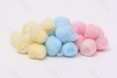 Yellow, blue and pink hygienic cotton balls