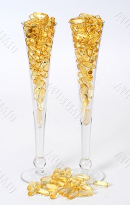 Two glasses with gold boluses