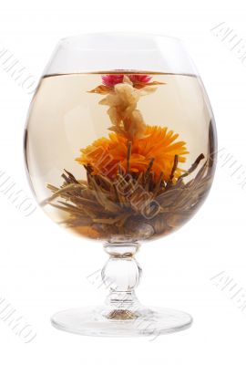 Glass with a flower green tea