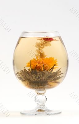 Glass with a flower green tea