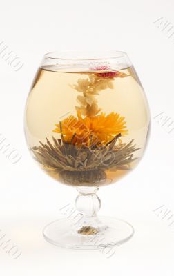 Glass with a flower green tea