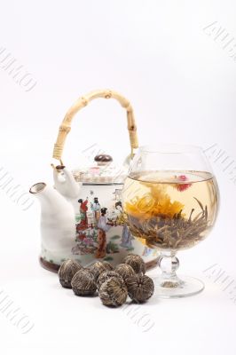 Teapot and Glass with a flower green tea